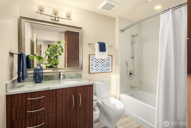 bathroom with toilet, shower / bath combination with curtain, vanity, and visible vents