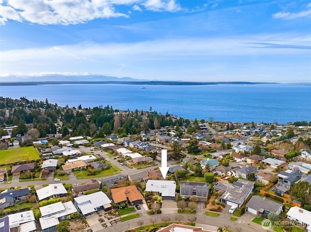 bird's eye view featuring a water view and a residential view