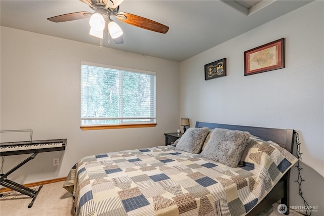 bedroom with ceiling fan and carpet