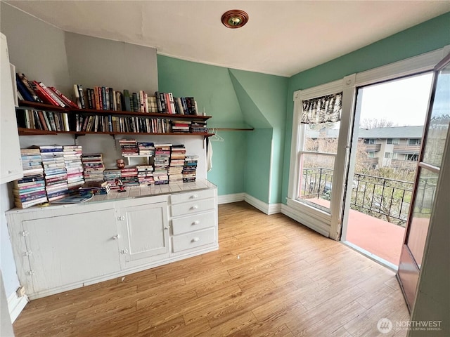 office space with light wood finished floors and baseboards