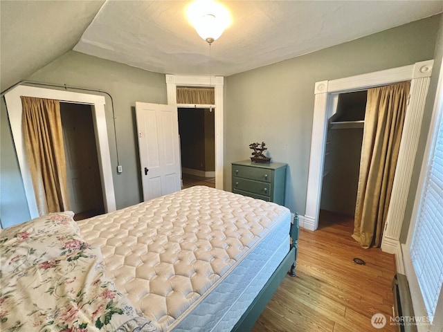 bedroom with wood finished floors