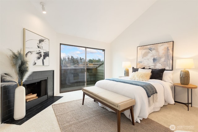 carpeted bedroom with access to outside, high vaulted ceiling, a fireplace with flush hearth, and baseboards