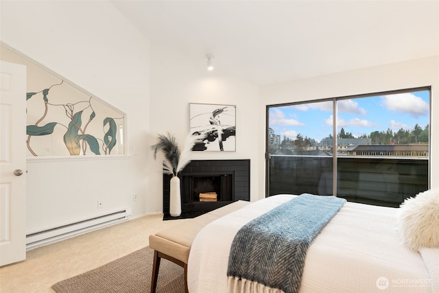 carpeted bedroom with access to outside, vaulted ceiling, baseboard heating, and a fireplace with flush hearth