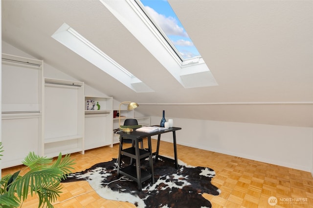 office with vaulted ceiling and baseboards