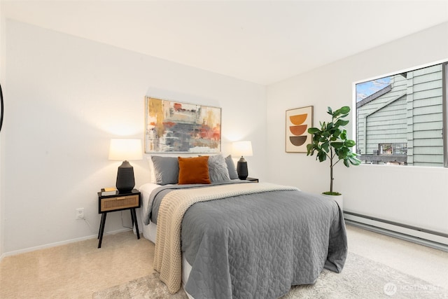 bedroom featuring a baseboard heating unit, baseboards, and light colored carpet