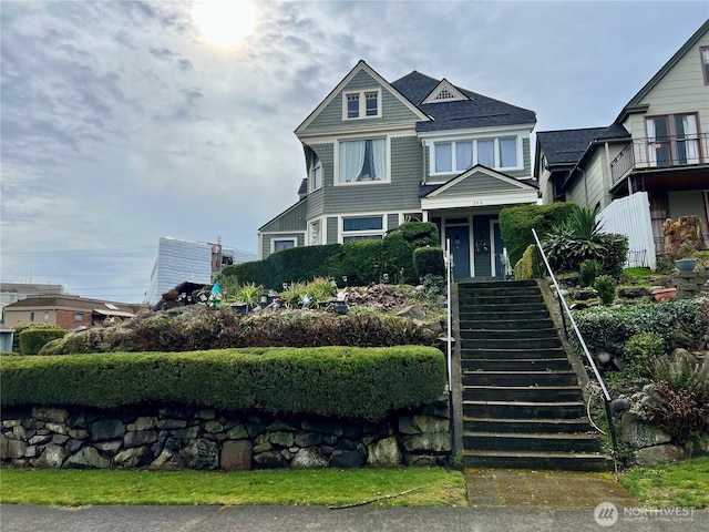 view of front of home with stairs