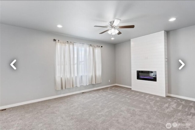 unfurnished living room with a fireplace, recessed lighting, a ceiling fan, carpet flooring, and baseboards