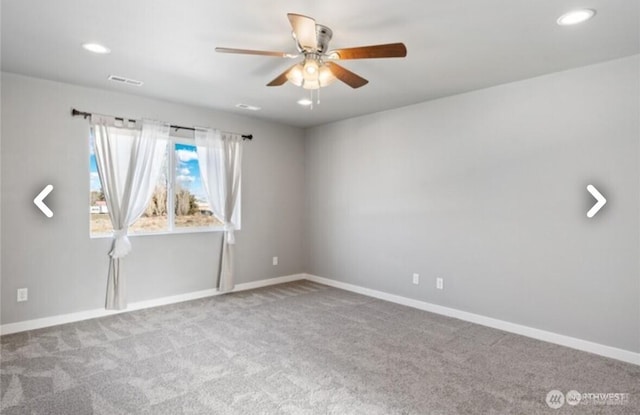 carpeted empty room featuring recessed lighting, visible vents, ceiling fan, and baseboards