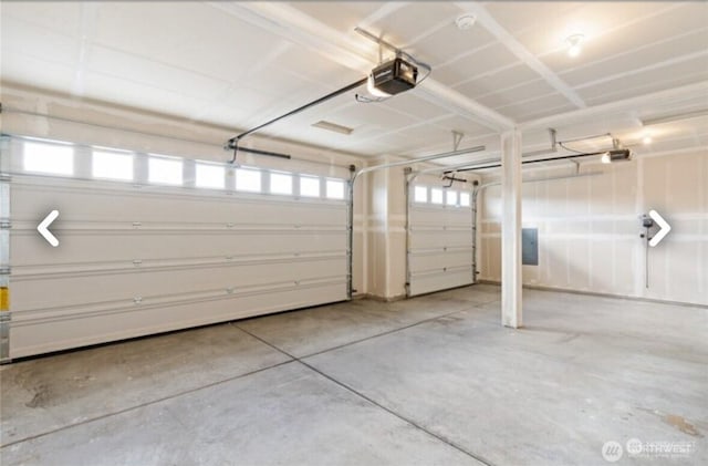 garage featuring a garage door opener