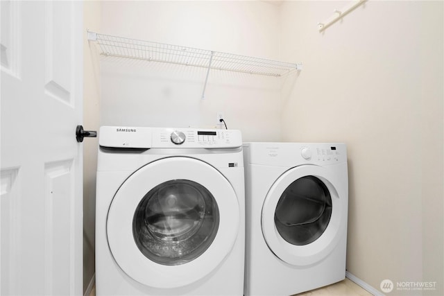 laundry area featuring washer and dryer and laundry area