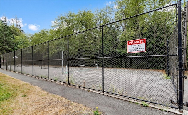 view of sport court with fence