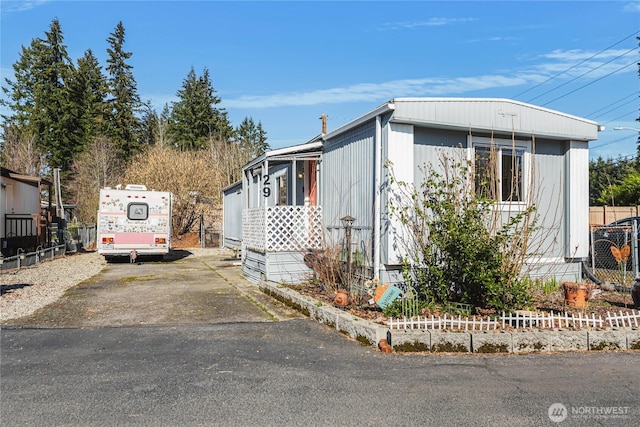 view of side of home with fence