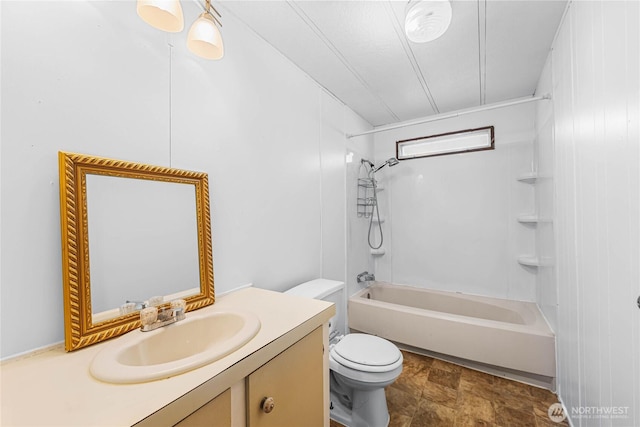 bathroom featuring toilet, bathtub / shower combination, and vanity