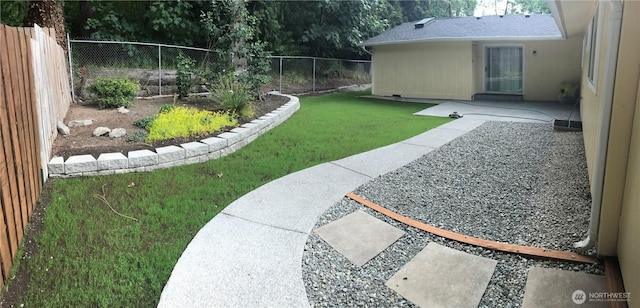 view of yard featuring a fenced backyard and a patio