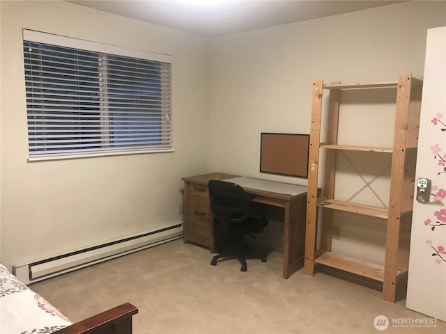 office space with baseboard heating and carpet