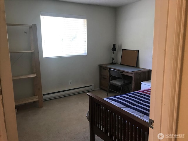 carpeted bedroom with baseboard heating