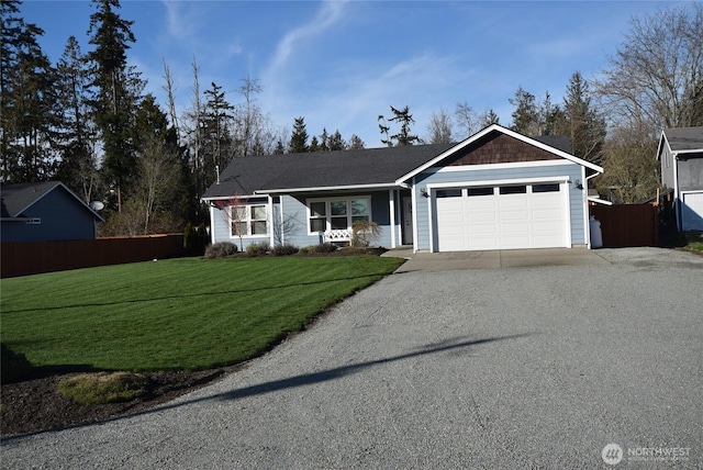 ranch-style house with a garage, a front yard, driveway, and fence