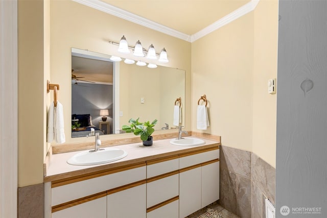 full bath with ornamental molding, a sink, ensuite bathroom, and double vanity