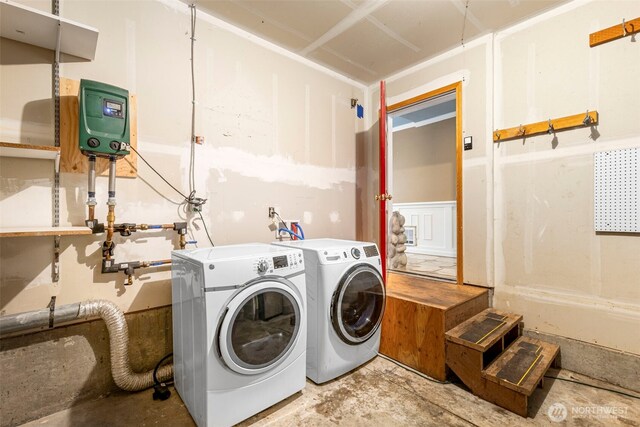 laundry room featuring washing machine and dryer and laundry area