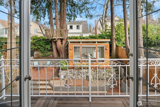 view of front of home with a fenced front yard and a gate