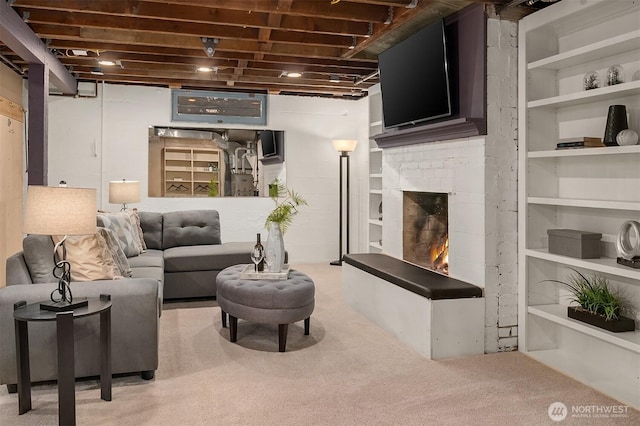 carpeted living room with built in shelves and a fireplace