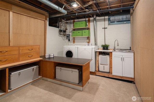 interior space with washer and dryer and a sink