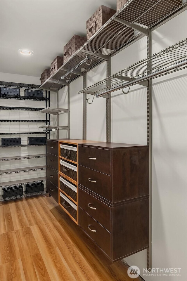 walk in closet featuring light wood-type flooring