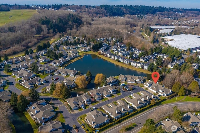 bird's eye view featuring a water view and a residential view