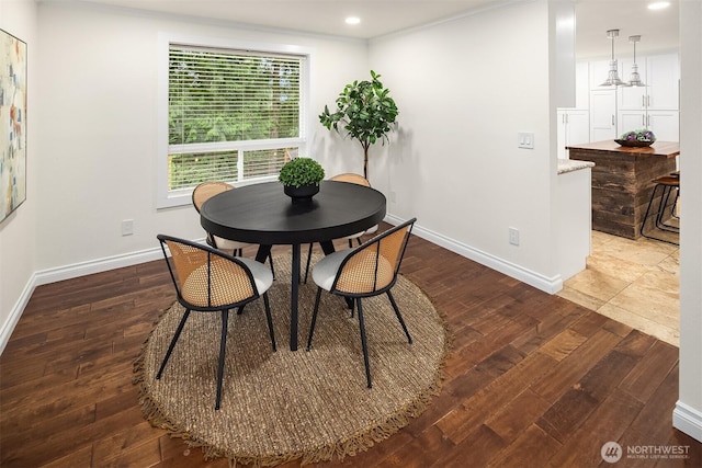 dining area featuring recessed lighting, baseboards, and hardwood / wood-style flooring