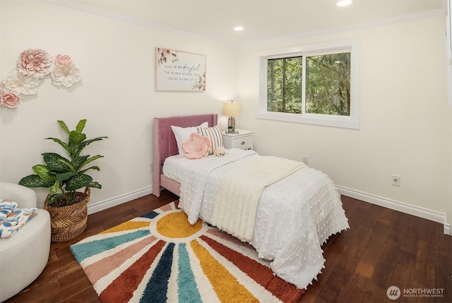 bedroom featuring recessed lighting, baseboards, wood finished floors, and crown molding