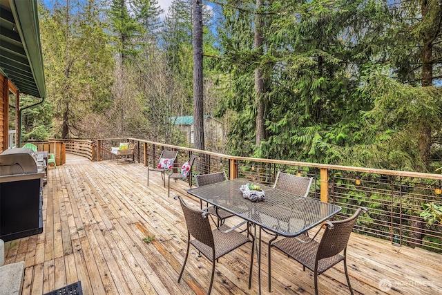 deck with outdoor dining space