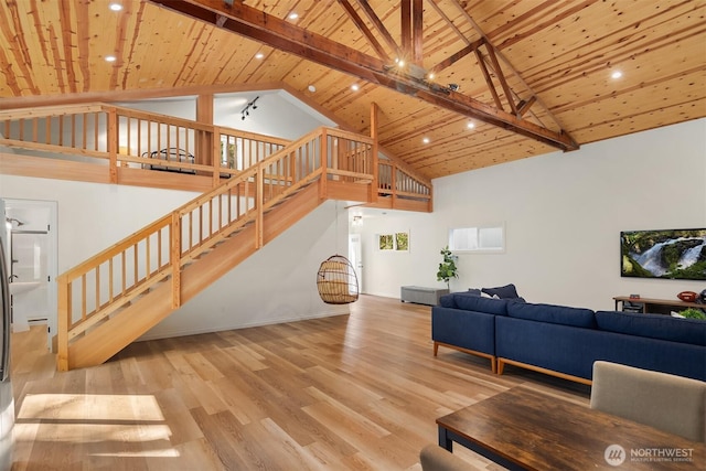 living room with stairway, wood ceiling, and wood finished floors