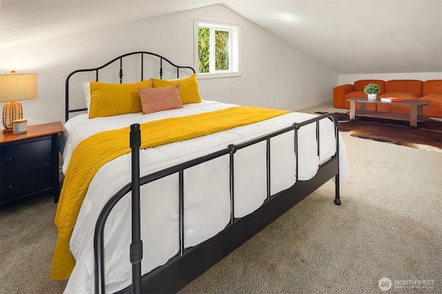 carpeted bedroom featuring vaulted ceiling