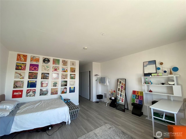 bedroom with wood finished floors