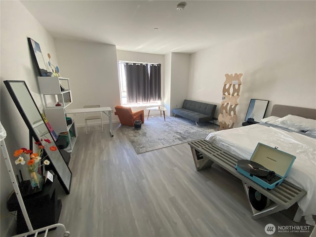 bedroom with wood finished floors