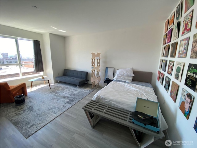 bedroom with wood finished floors