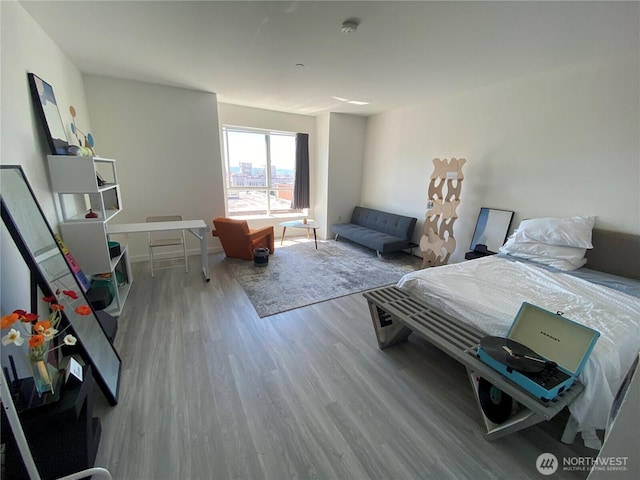 bedroom with wood finished floors