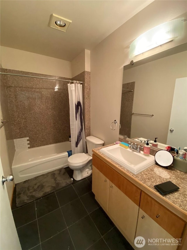 full bathroom featuring toilet, tile patterned floors, shower / bath combo with shower curtain, and vanity