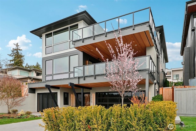 1658 10th St W, Kirkland, WA 98033 - rear view of house featuring a balcony and stucco siding