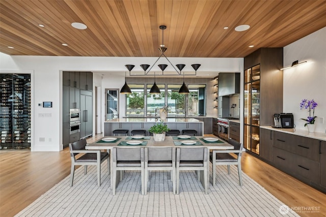 1658 10th St W, Kirkland, WA 98033 - dining area with light wood finished floors, wooden ceiling, and recessed lighting