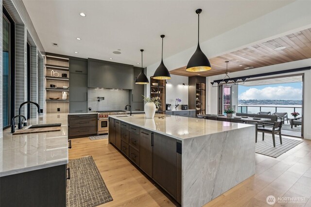 1658 10th St W, Kirkland, WA 98033 - kitchen with a sink, exhaust hood, modern cabinets, backsplash, and open shelves