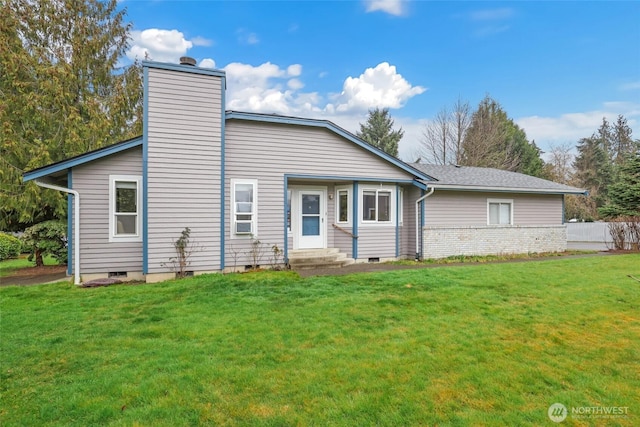 view of front of house featuring a chimney, crawl space, a front yard, and entry steps