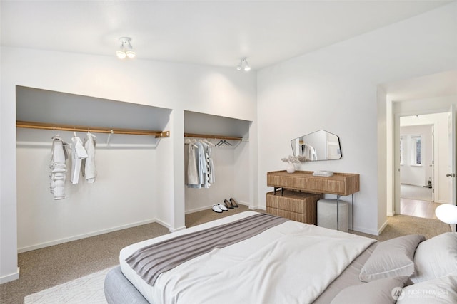 bedroom featuring carpet floors and baseboards