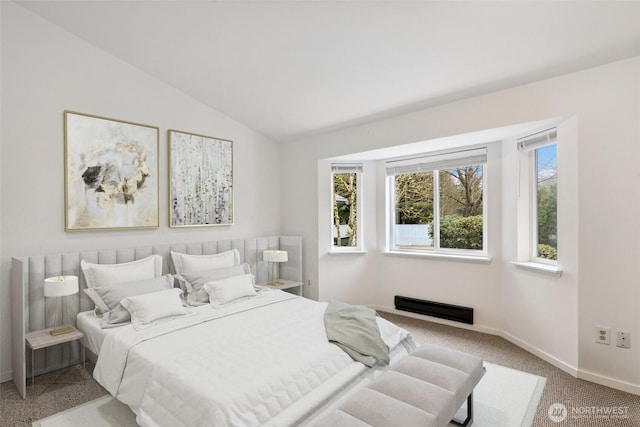 bedroom featuring carpet flooring, vaulted ceiling, and baseboards