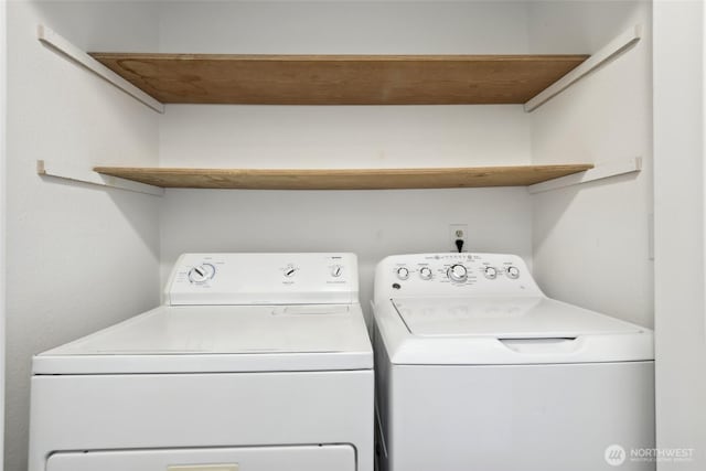 laundry area with laundry area and washer and clothes dryer