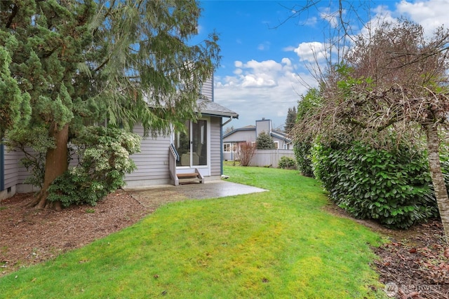 view of yard featuring a patio and fence