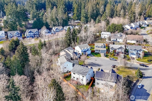 bird's eye view featuring a residential view and a view of trees