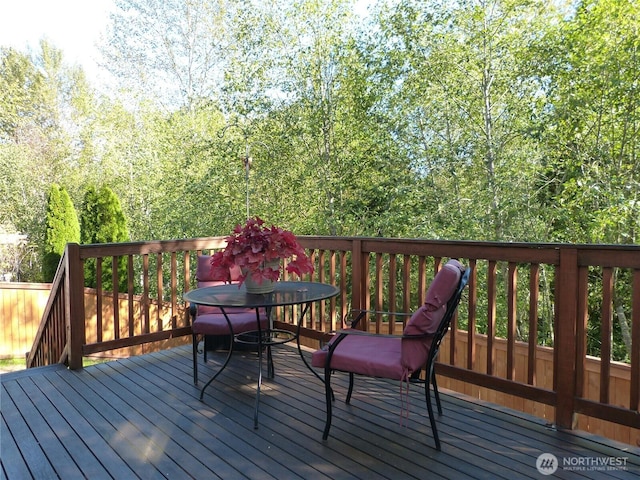 wooden deck with outdoor dining area