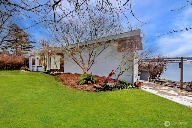 view of front of house with a garage and a front yard