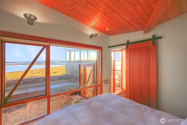 unfurnished bedroom with access to exterior, a water view, lofted ceiling with beams, a barn door, and wood ceiling